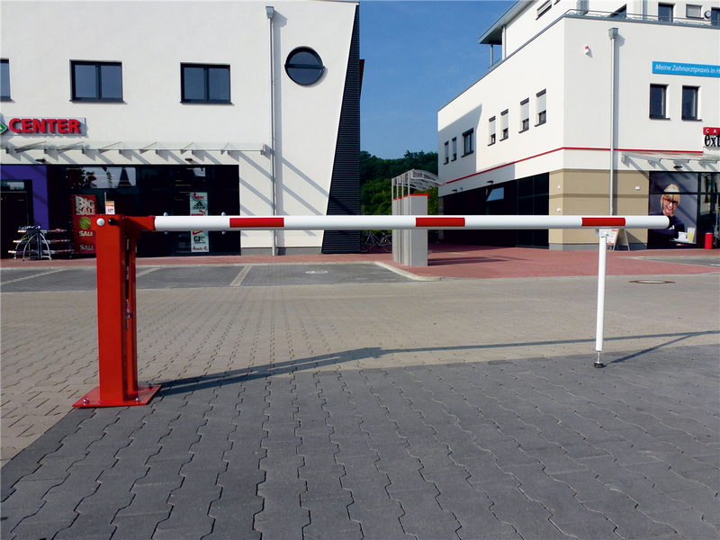 Manual barrier with pneumatic spring and hinged pole support